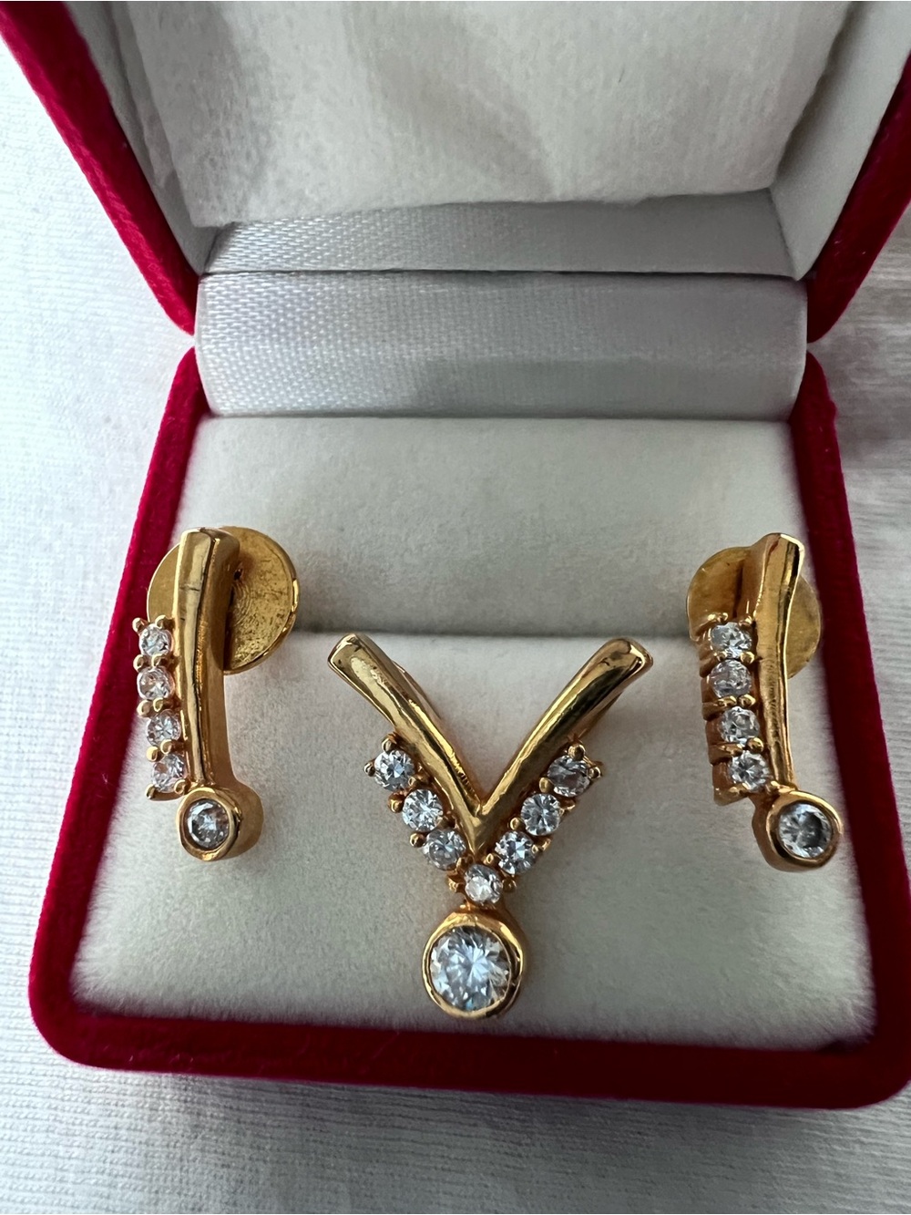 Gold-Tone V-Shaped Pendant and Stud Earrings Set with Clear Stones
